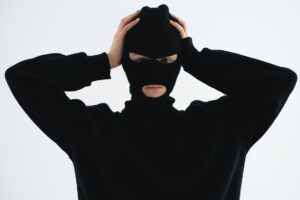 close up shot of a person wearing a robber mask