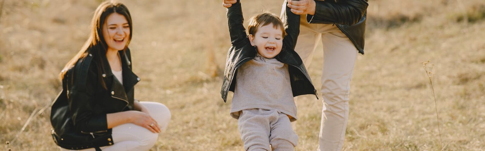 photo of family having fun with soccer ball