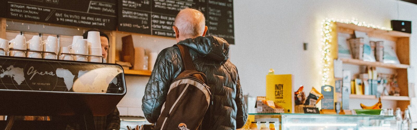 man standing in front of counter